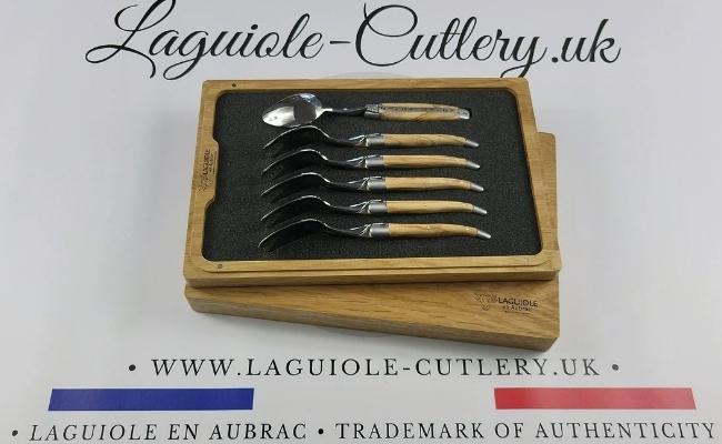 Six Laguiole dessert spoons with olive wood handles