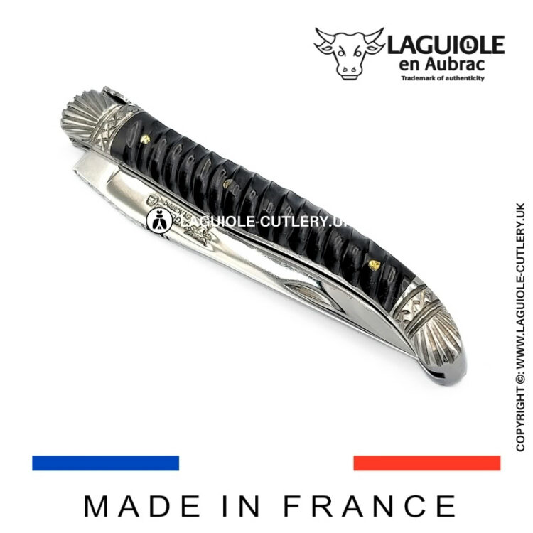 laguiole pocket knife with twisted ebony handle and chiselled spring and bolsters