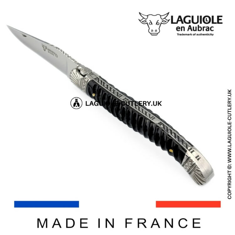 laguiole pocket knife with twisted ebony handle and chiselled spring and bolsters