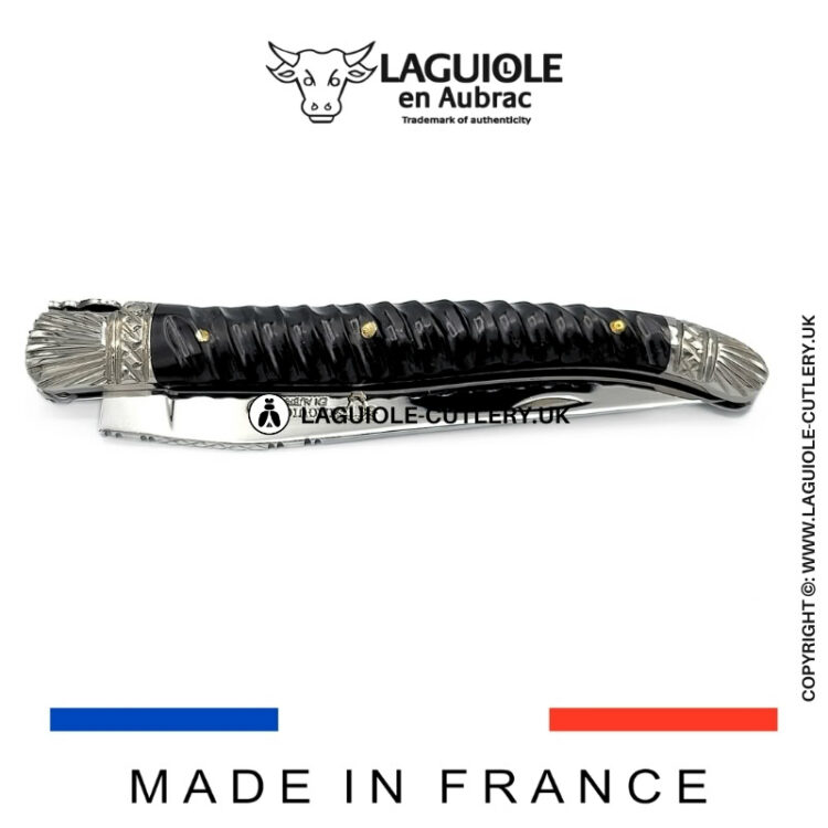 laguiole pocket knife with twisted ebony handle and chiselled spring and bolsters