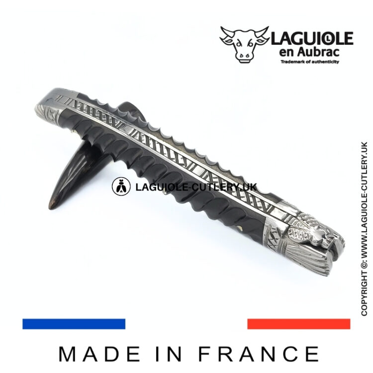 laguiole pocket knife with twisted ebony handle and chiselled spring and bolsters
