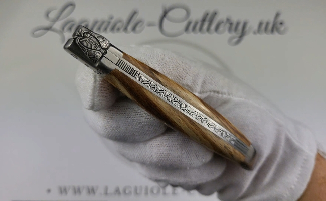 laguiole pocket knife in aubrac beech wood with sculpted bee and engraved bolsters and spring