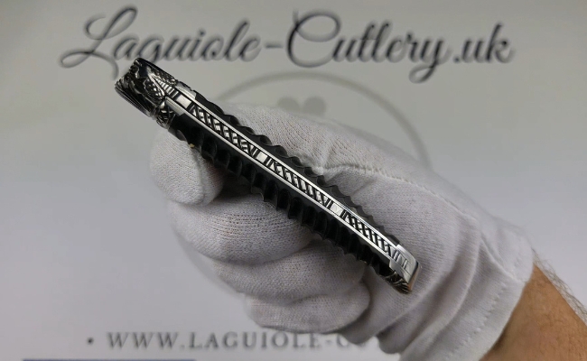 laguiole pocket knife with twisted ebony handle and chiselled spring and bolsters