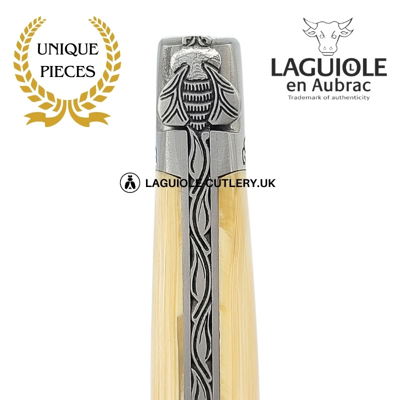 ivory flowers: laguiole pocket knife in fossil mammoth ivory – sculpted bee – engraved bolsters